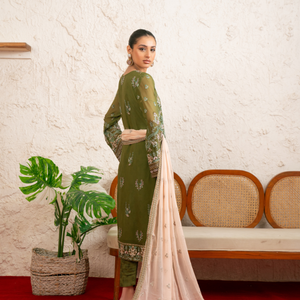 Model wearing PALWASHA 10 green Pakistani embroidered chiffon suit by Noors