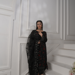 Model wearing GLAMOURA 08 black Pakistani embroidered chiffon suit by Noors