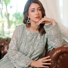 Model wearing BRISA 06 ferozi Pakistani embroidered chiffon suit by Noors