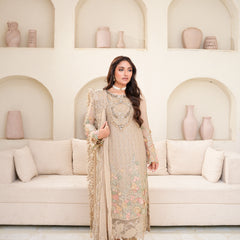 Model wearing SAHOOR 05 floral fawn Pakistani embroidered chiffon suit by Noors