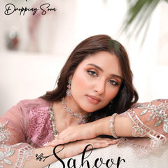 Model wearing SAHOOR floral Pakistani embroidered chiffon suit by Noors
