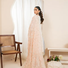 Model wearing RUA 04 peach Pakistani embroidered chiffon suit by Noors